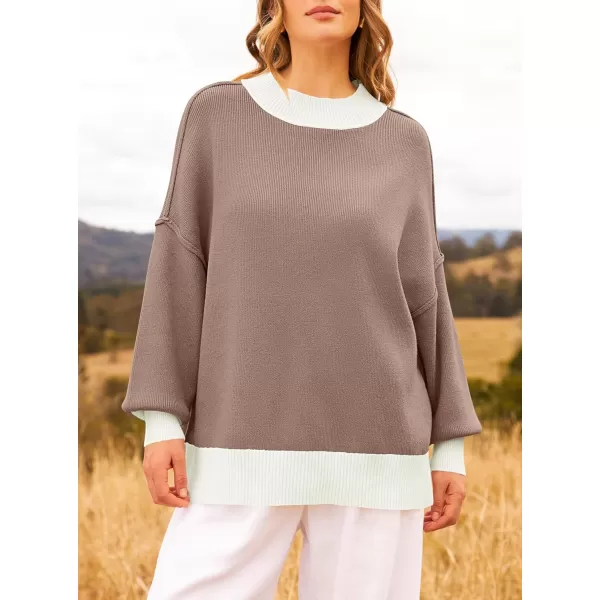 ZESICA Womens Winter Oversized Sweaters Long Sleeve Color Block Mock Neck Side Slit Comfy Loose Knitted Pullover TopsAlmond