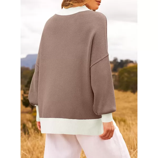 ZESICA Womens Winter Oversized Sweaters Long Sleeve Color Block Mock Neck Side Slit Comfy Loose Knitted Pullover TopsAlmond
