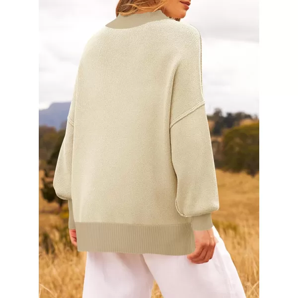 ZESICA Womens Winter Oversized Sweaters Long Sleeve Color Block Mock Neck Side Slit Comfy Loose Knitted Pullover TopsApricot