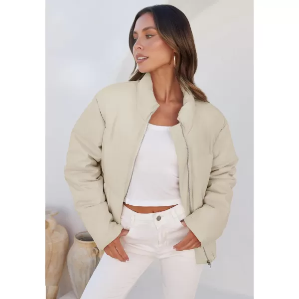 imageZESICA Womens Long Sleeve Cropped Puffer Jacket Winter Zipper Quilted Baggy Warm Short Down Coat Outwear with PocketsApricot