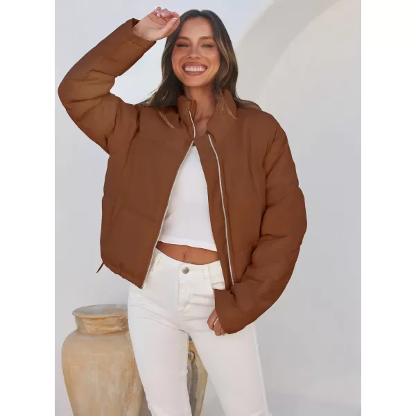 imageZESICA Womens Long Sleeve Cropped Puffer Jacket Winter Zipper Quilted Baggy Warm Short Down Coat Outwear with PocketsCaramel