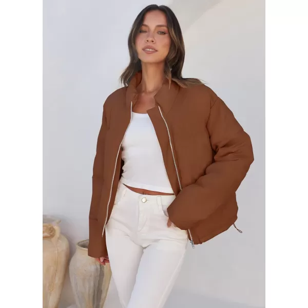 imageZESICA Womens Long Sleeve Cropped Puffer Jacket Winter Zipper Quilted Baggy Warm Short Down Coat Outwear with PocketsCaramel
