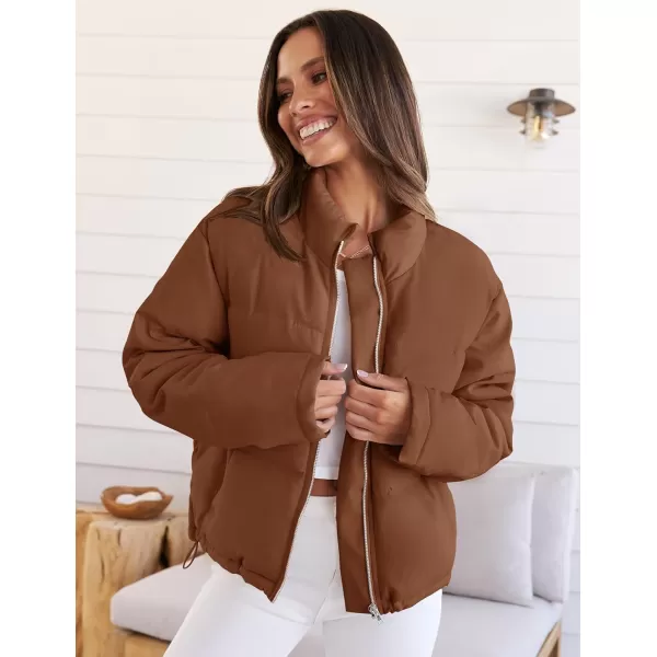 imageZESICA Womens Long Sleeve Cropped Puffer Jacket Winter Zipper Quilted Baggy Warm Short Down Coat Outwear with PocketsCaramel