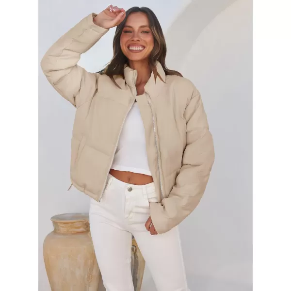 imageZESICA Womens Long Sleeve Cropped Puffer Jacket Winter Zipper Quilted Baggy Warm Short Down Coat Outwear with PocketsLightkhaki