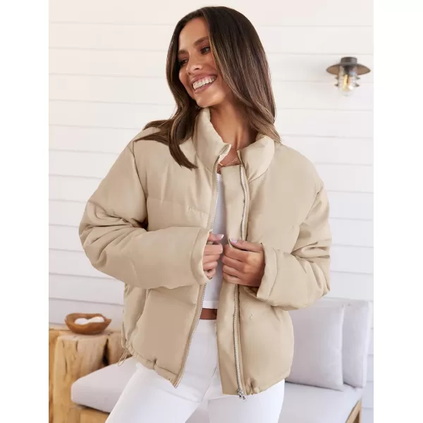 imageZESICA Womens Long Sleeve Cropped Puffer Jacket Winter Zipper Quilted Baggy Warm Short Down Coat Outwear with PocketsLightkhaki