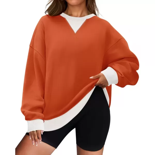 imageZESICA Womens Crewneck Color Block Sweatshirts Oversized Long Sleeve Pullover Tunic Tops 2024 Fall Clothes OutfitsOrange