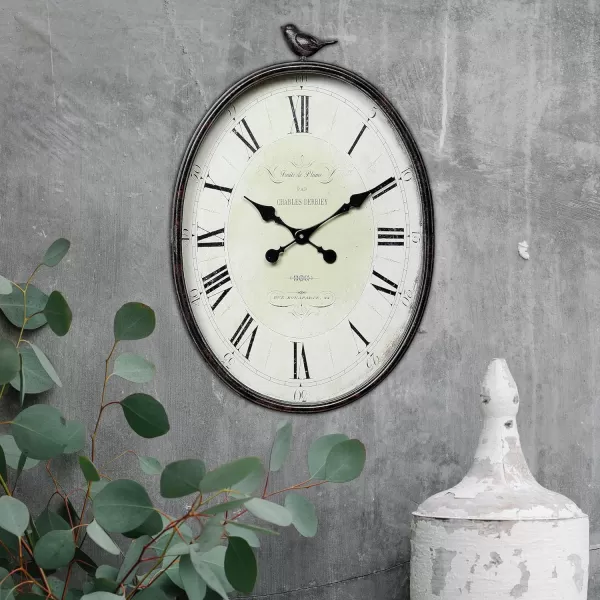Creative CoOp Oval Metal Wall Clock with Bird