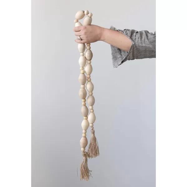 Creative CoOp 60quot L Mango Wood Bead Jute Tassels Garland OffWhite