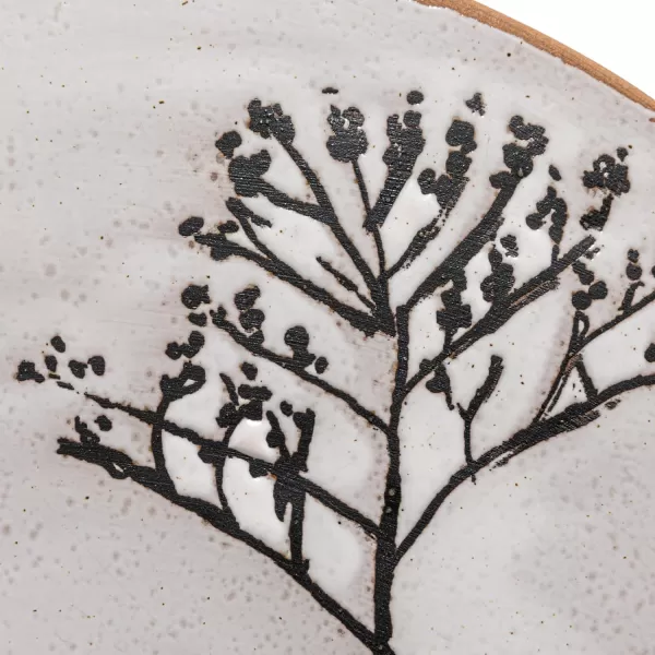 imageCreative CoOp 12 Inches Round Debossed Stoneware Flowers and Reactive Glaze White and Black Pedestal
