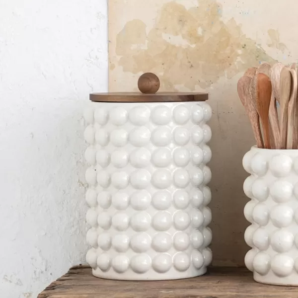 imageCreative CoOp 675 Inches Round Stoneware Raised Dots and Acacia Wood Lid White and Natural Canister