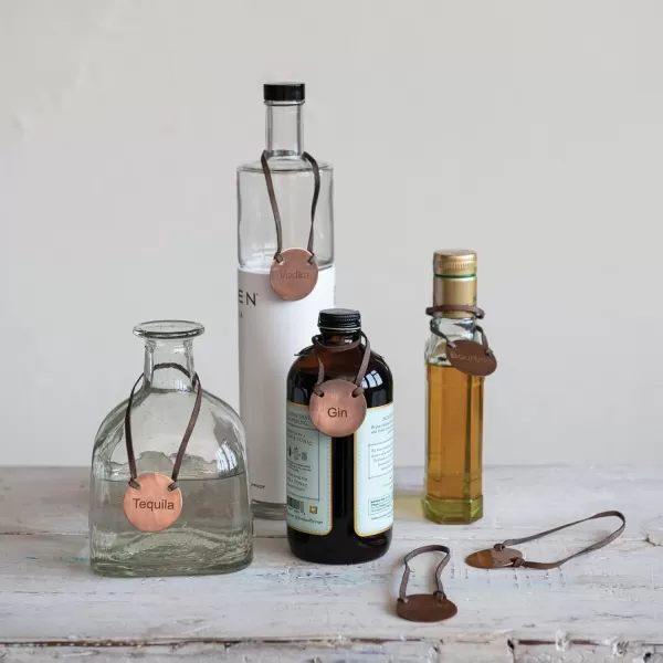 imageCreative CoOp Buffalo Leather and Cast Iron Engraved Metal Bottle Tags Set of 6 Kitchen Utility Copper