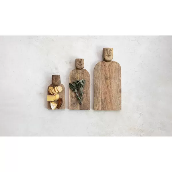 imageCreative CoOp Medium HandCarved Mango Wood Slicer Face Handle Design and Combed Finish Natural Cheese and Cutting Board