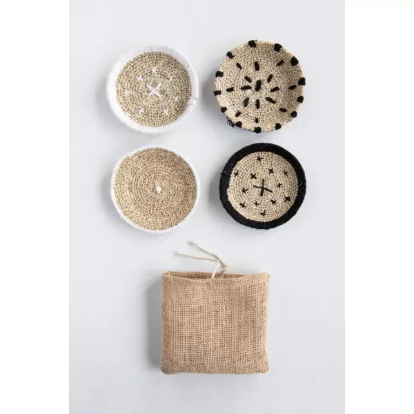 imageCreative CoOp Round Handwoven Natural Seagrass Stitching Set of 4 Burlap Bag Coasters Black 4 Count