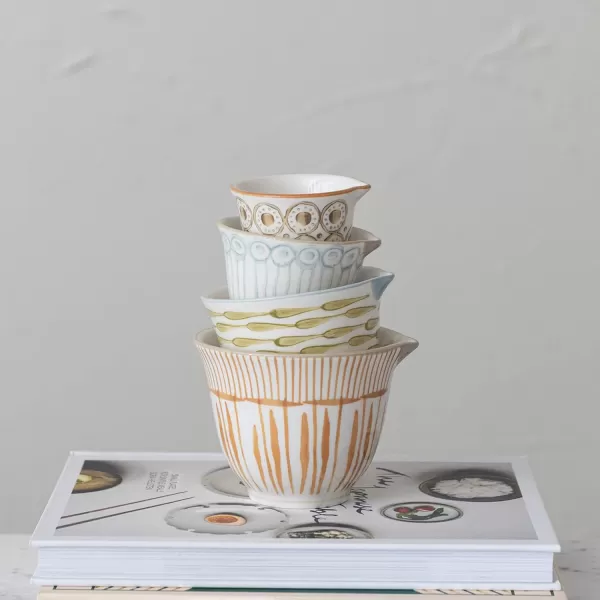 imageCreative CoOp Stoneware Pour Spout Set of 4 Sizes Multicolor Measuring Cups Multi