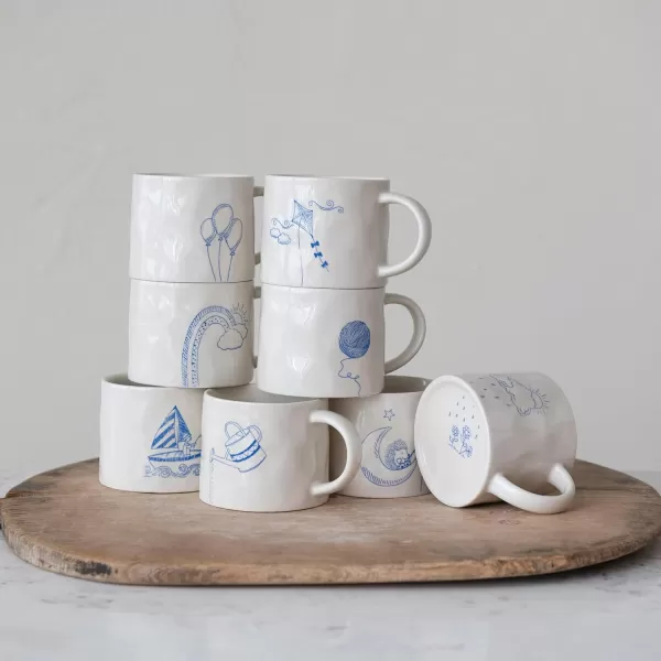 imageCreative CoOp Stoneware Wax Relief Illustration and Secret Image on Bottom Cream and Blue Set of 8 Styles Mugs Multi