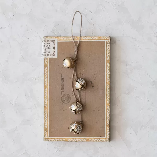 imageCreative CoOp 9quot H Hanging Metal Jingle Bells with HandPainted StarsSnowflakes on Jute Rope Hanger Gold Finish White and Natural