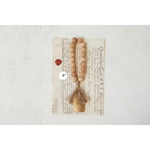imageCreative CoOp Metal Bell and Mango Wood Bead Door Hanger with Jute Fringe Antique Gold Finish Natural