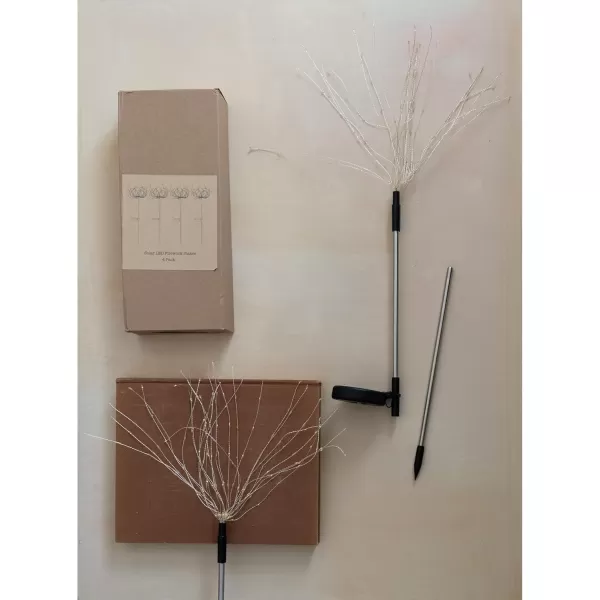 imageCreative CoOp Stainless Steel Stake with LED Solar Powered Starburst Light and 180 Lights Black Set of 4