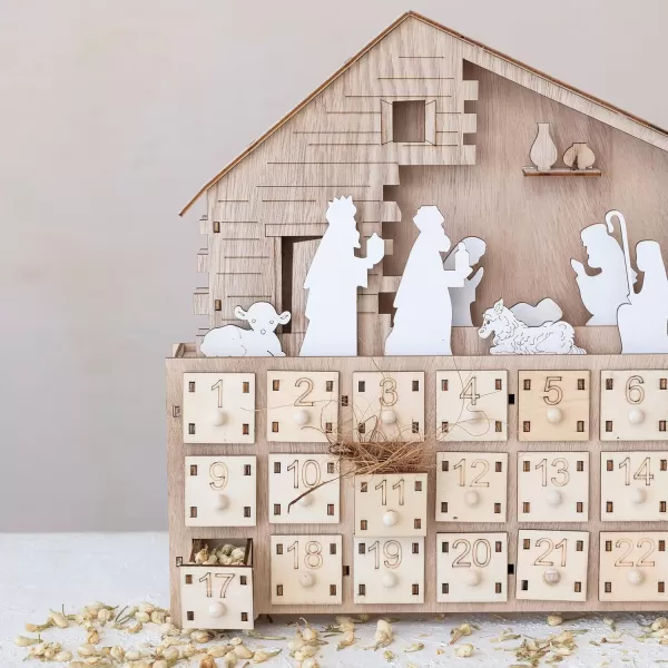 imageCreative CoOp Wood Laser Cut Nativity Advent Calendar with LED Light and Drawers Natural