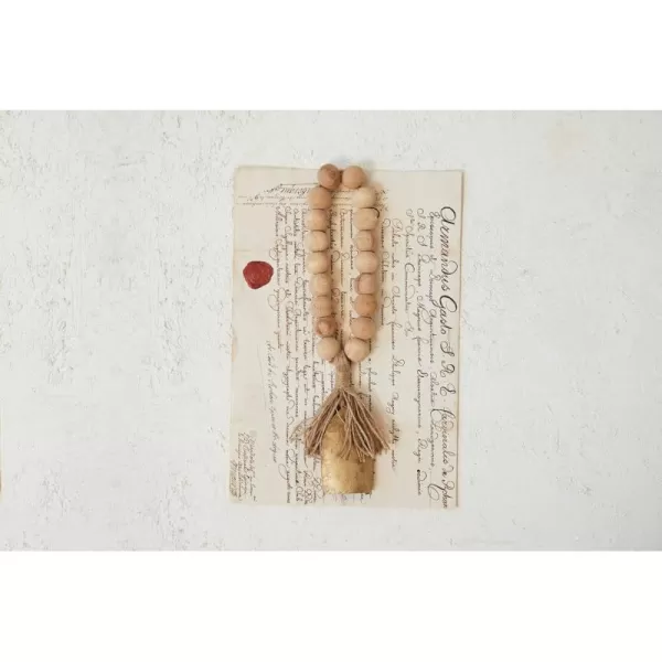 imageCreative CoOp Metal Bell and Mango Wood Bead Door Hanger with Jute Fringe Antique Gold Finish Natural