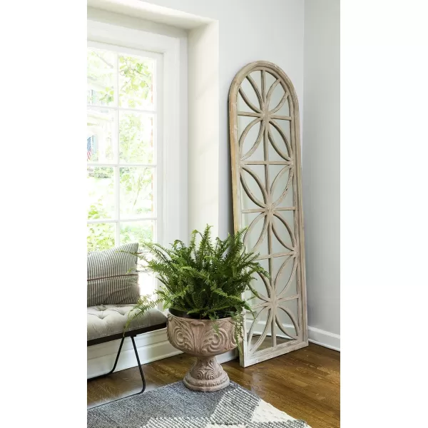 imageCreative CoOp Arched Wood Framed Mirror with Petal Designs