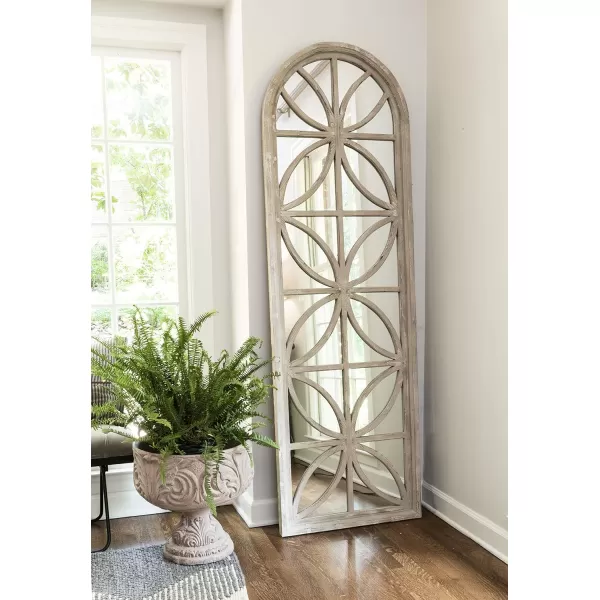 imageCreative CoOp Arched Wood Framed Mirror with Petal Designs