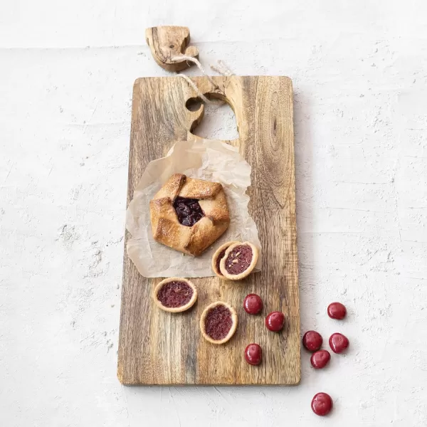 imageCreative CoOp Mango Wood Cheese and Cutting Board with Santa Hat CutOut Natural