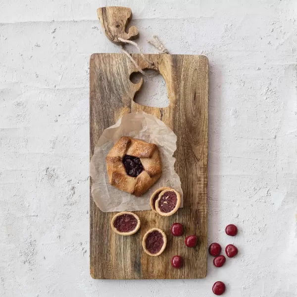 imageCreative CoOp Mango Wood Cheese and Cutting Board with Santa Hat CutOut Natural