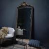 imageCreative CoOp Distressed Resin Framed Wall Mirror Black and Gold
