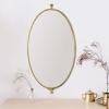 imageCreative CoOp Distressed Oval Metal Framed Pivoting Wall Mirror Gold