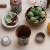 imageCreative CoOp Bohemian Charm Stoneware Vase with Handle Multicolor Set of 45 Bowl