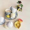 imageCreative CoOp Blossom Elegance Round Stoneware Plates Multicolor Set of 4Mug