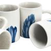 imageCreative CoOp Farmhouse Hand Stoneware Painted Flora and Fauna 4 Styles Set of 12 Antique White and Blue Mug