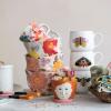 imageCreative CoOp Stoneware Mugs with Painted Winged Insects Set of 4 Styles Multicolor