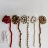 imageCreative CoOp Handmade Wool Felt Ball Garland in Printed Drawstring Bag Oatmeal Color