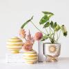 imageCreative CoOp Striped Stoneware Vase with Sphere Shape and Footed Base Yellow and White