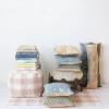 imageCreative CoOp Cotton Tufted Pouf with Plaid Pattern Blush and Cream