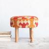 imageCreative CoOp Round Cotton and Wool Kilim Stool with Wood Legs Natural and Orange