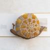 imageCreative CoOp Mustard HandWoven Fabric IndoorOutdoor Snail Shaped Pillow Brown
