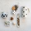 imageCreative CoOp Farmhouse Stoneware Painted Polka Dots Ivory and Black Pitcher