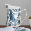 imageCreative CoOp Stoneware Pitcher with Painted Rabbit and Florals Blue and Cream
