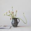 imageCreative CoOp Stoneware Wax Relief Botanicals Black and Natural Pitcher