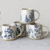 imageCreative CoOp Hand Stamped Stoneware Wax Relief Botanical Design Antique Blue and White Set of 4 Styles Mugs