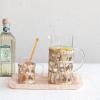 imageCreative CoOp Round Glass Mug with Woven Sleeve Natural Set of 12