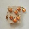 imageCreative CoOp Embossed Mercury Glass Ornament Garland on Gold Cord Apricot Color