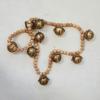 imageCreative CoOp Wood Bead and Metal Bell Garland Natural and Antique Gold Finish