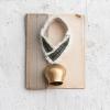 imageCreative CoOp Metal Cowbell with Cotton Patterned Hanger Gold Finish