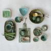 imageCreative CoOp Round Stoneware Bowl with Reactive Crackle Glaze Teal Set of 4