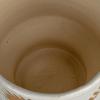 imageCreative CoOp Stoneware Footed Planter with Flower Reactive Glaze White and Mustard