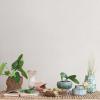 imageCreative CoOp Embossed TerraCotta Footed Vase Planter with Dot Pattern and Crackle Glaze Green
